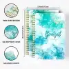 A5 Blue Marble Budget Planner with gold foil text, shown open to the monthly budget tracking layout on thick, 100gsm paper.