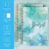 A5 Blue Marble Budget Planner with gold foil text, shown open to the monthly budget tracking layout on thick, 100gsm paper.