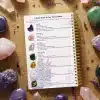 A quick guide page inside the Crystal Journal listing popular crystals like Amethyst and Rose Quartz with their properties and uses.