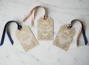 Luxury hang tag with gold foil and silk ribbon